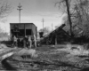 Men push hopper car