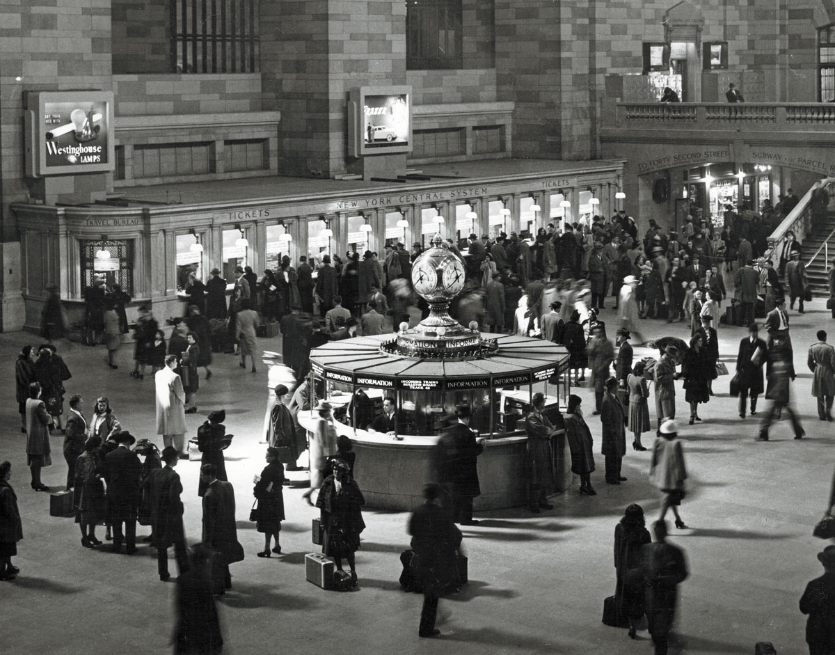 People walking around inside grand central station