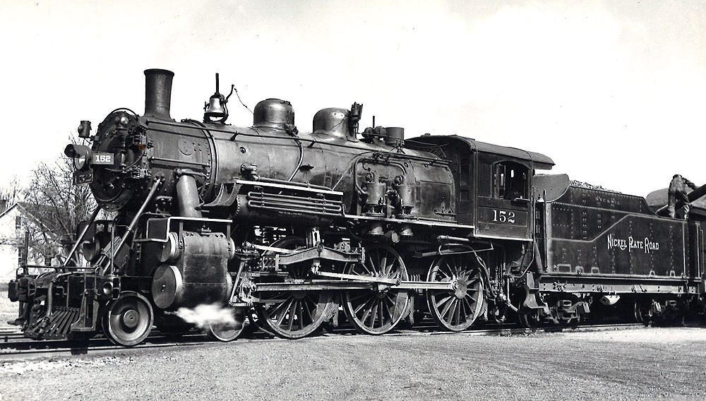 A close up black and white picture of 4-6-0 steam locomotive No. 152