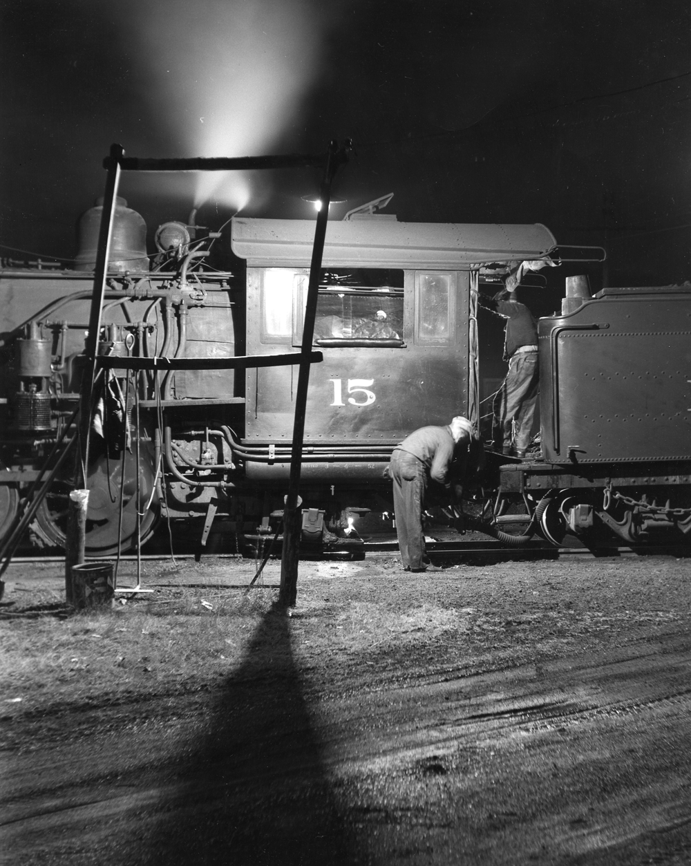 Two people working on a train