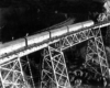 Five diesel locomotives on steel viaduct