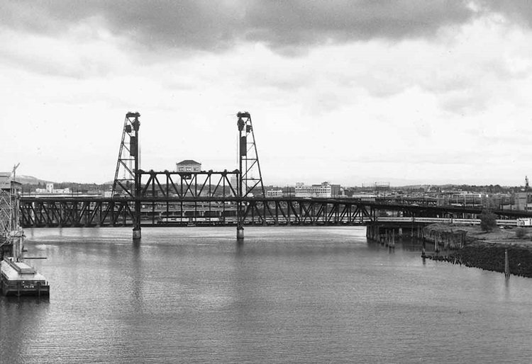 Passenger train on double deck steel lift bridge