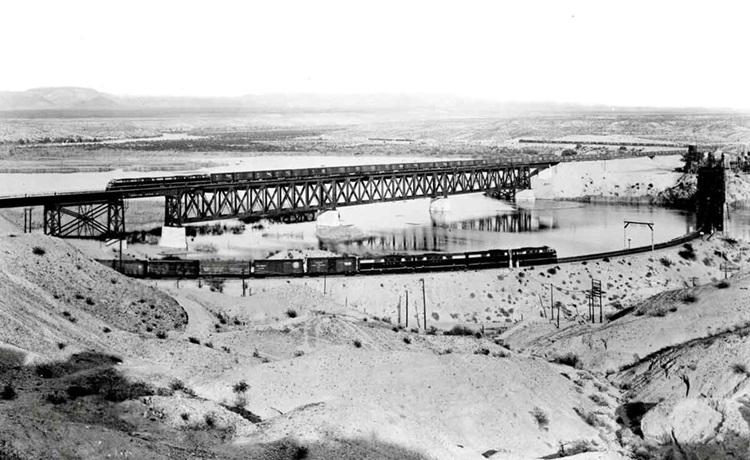 Trains pose on parallel bridges