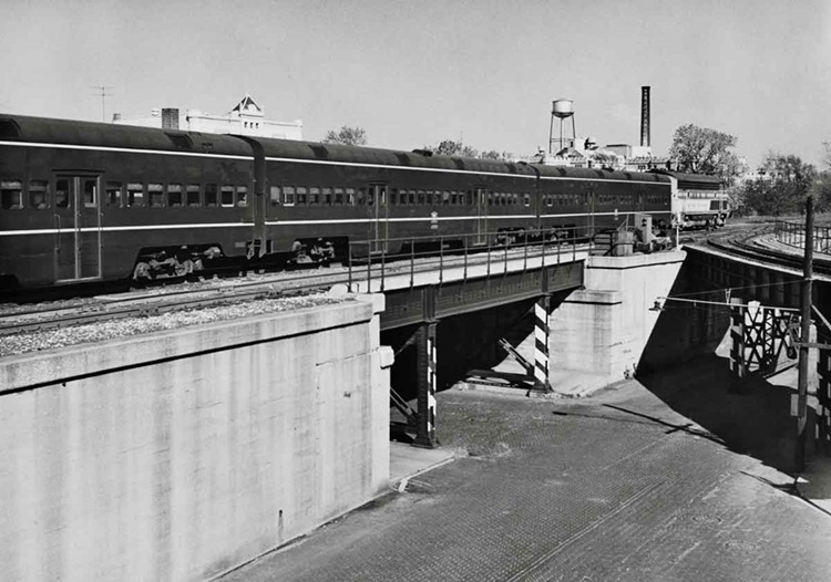 Commuter passenger train on raised right-of-way