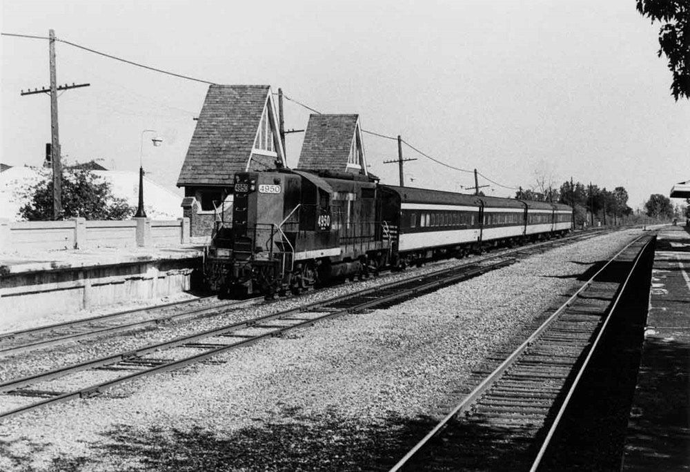 a passenger train by a station
