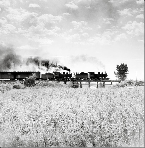 Two steam locomotives on wooden trestle