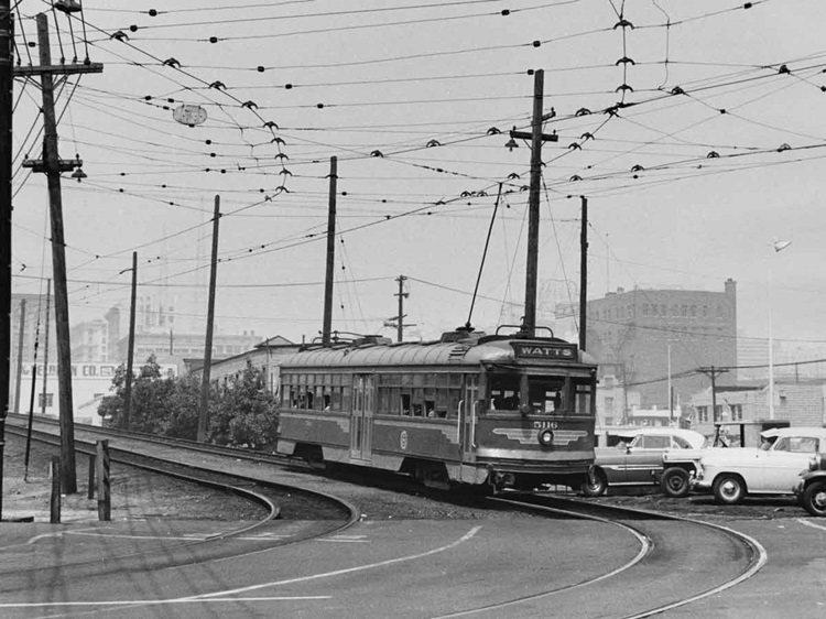 Streetcar about to take a curve toward the photographer.