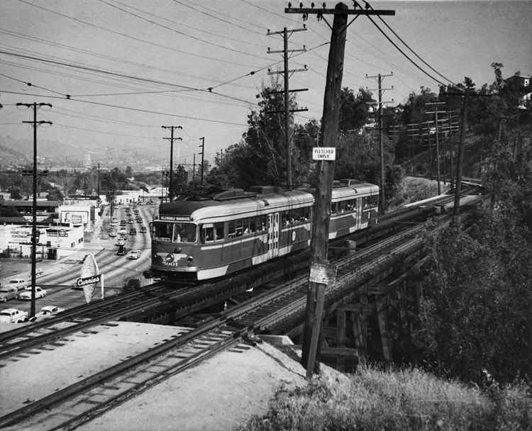 Two connected PCC-style electric streetcars.