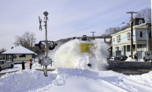 A snowplow plowing snow