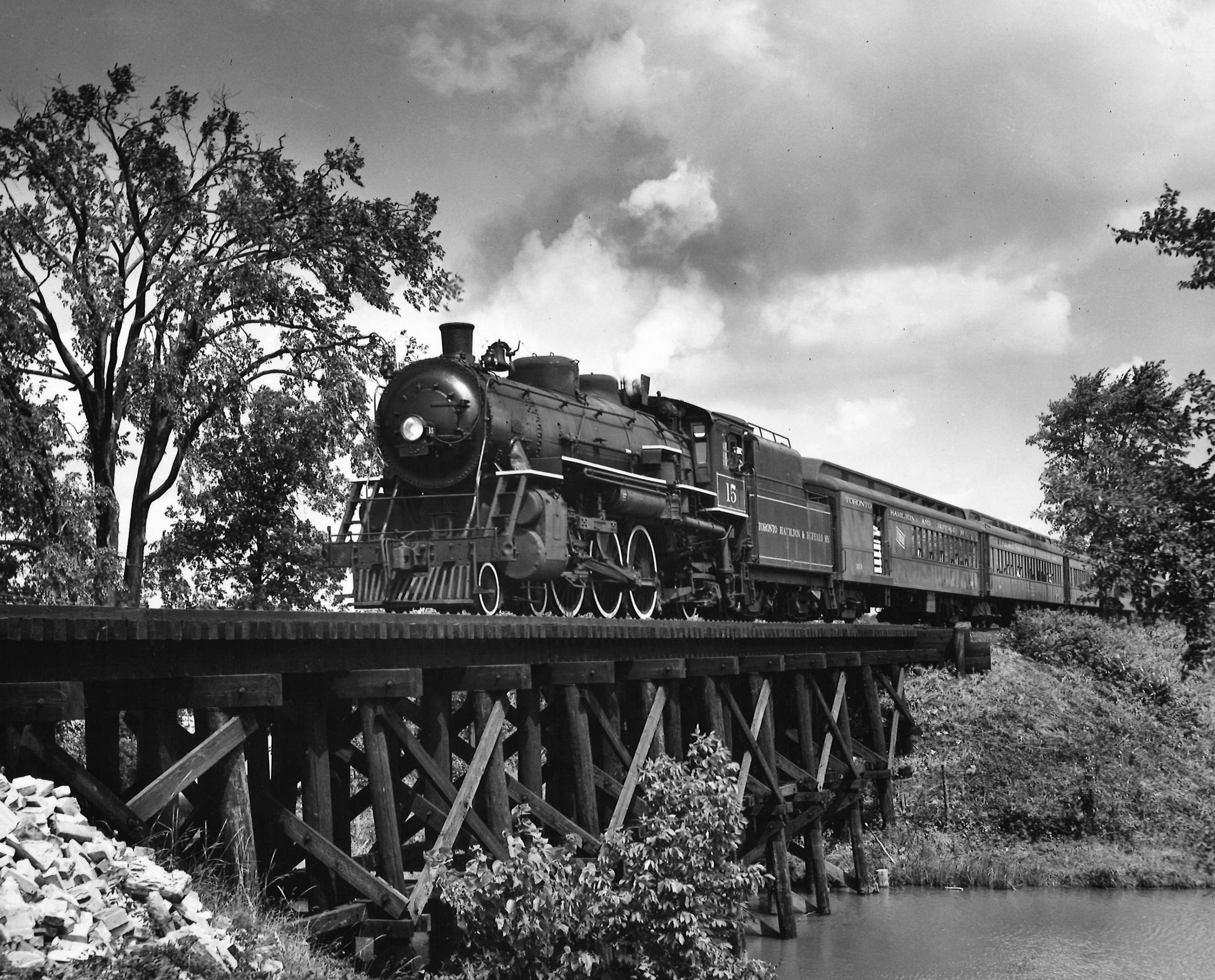Toronto, Hamilton & Buffalo 4-6-2 steam locomotive with passenger train on bridge
