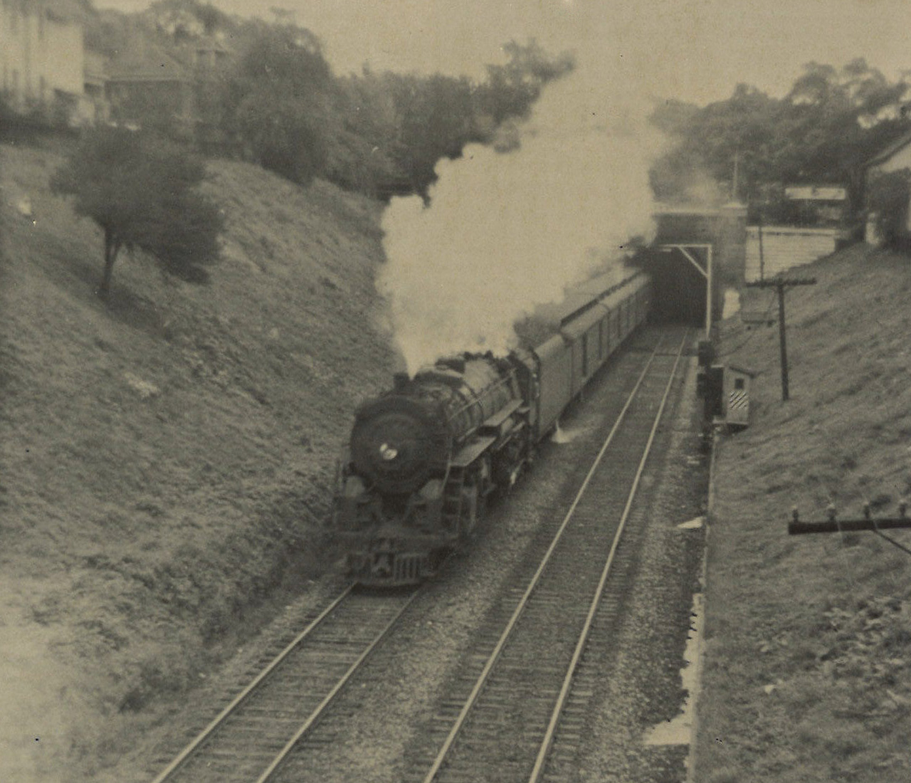Toronto, Hamilton & Buffalo 4-6-4 steam locomotive with passenger train exiting tunnel