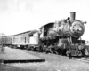 nn Arbor 4-4-2 steam locomotive with passenger train.