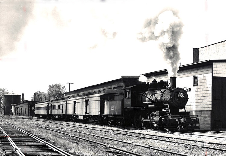 Ann Arbor 4-6-0 steam locomotive with passenger train .