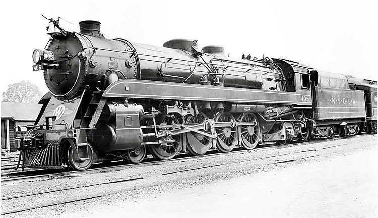 Angled front image of a 4-8-2 steam locomotive.