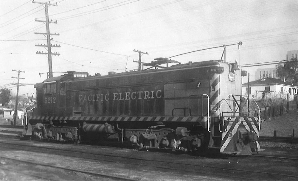 A large diesel locomotive on a multi-track mainline.