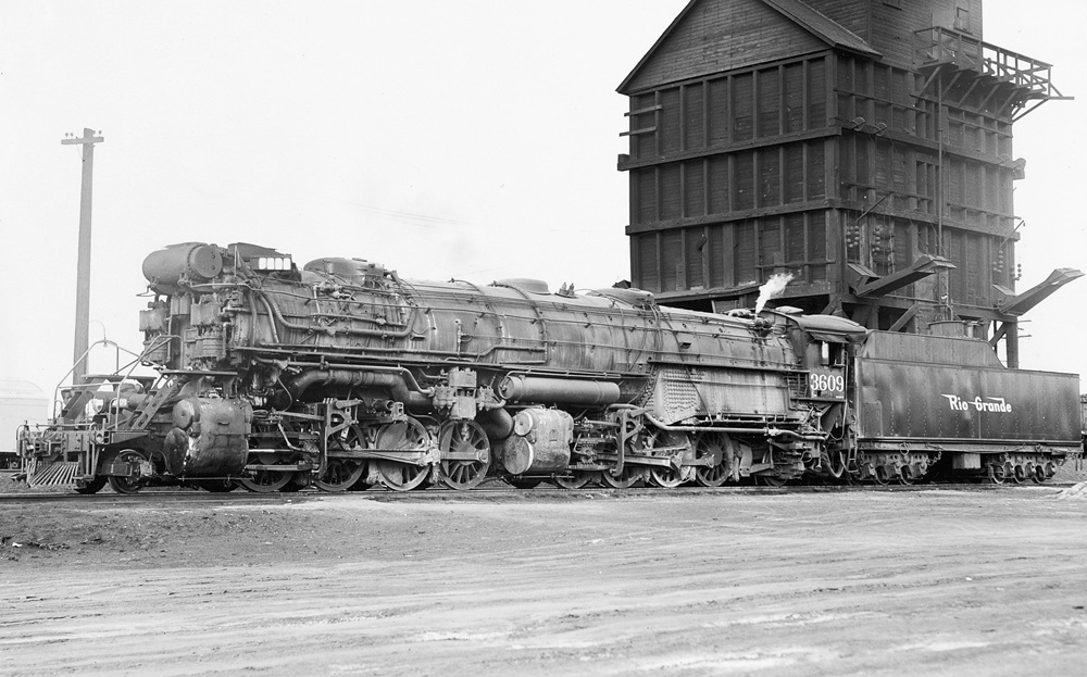 Side view of a large 2-8-8-2 articulated steam locomotive.