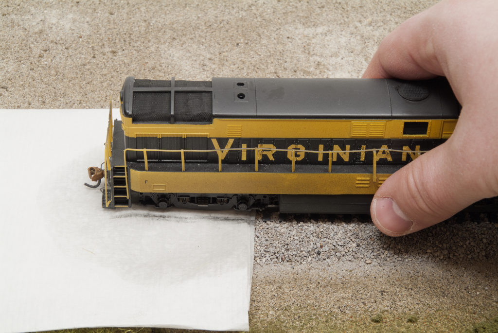 Towel offset on rails with front truck of H-16-44 on clean section of towel wetted with isopropyl alcohol.