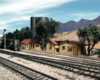 Second-generation diesel locomotives pose in front of a depot — a main thoroughfare for the Santa Fe in the steam-to-diesel transition era.