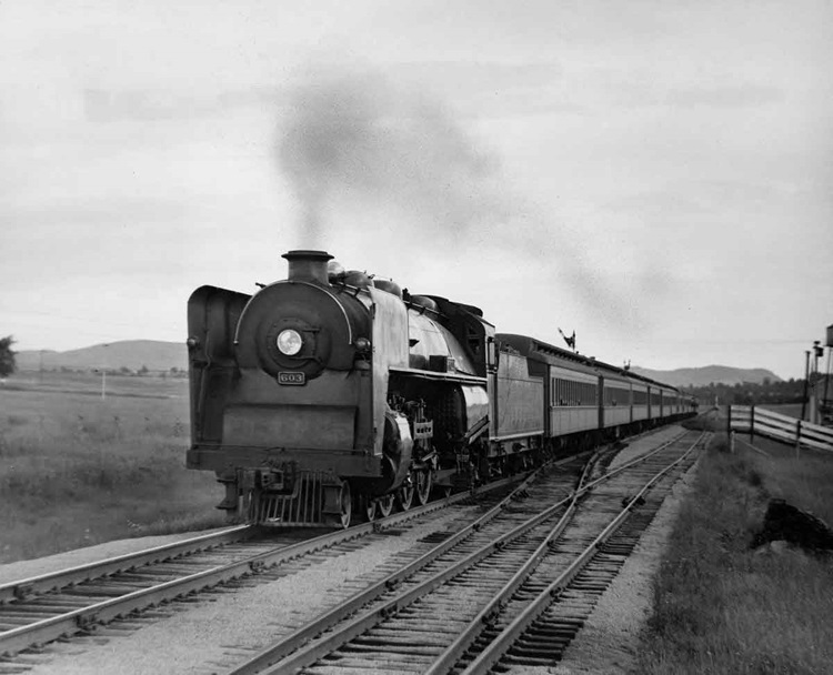 Pacific 603 with New York–Montreal Laurentian, second section (New York–Plattsburgh only, with day coaches for summer campers) near Essex, N.Y., early 1940s.
