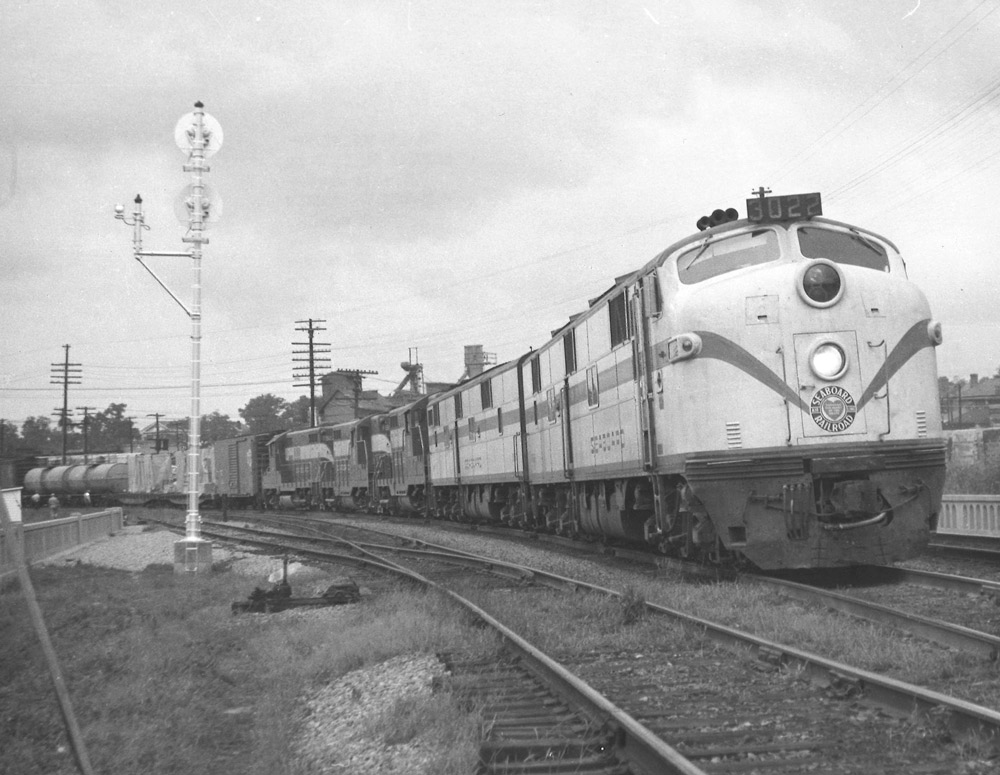Streamlined and road-switcher diesel locomotives on freight train