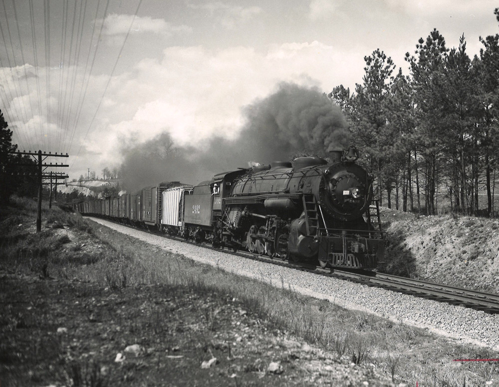 Steam locomotive with freight train