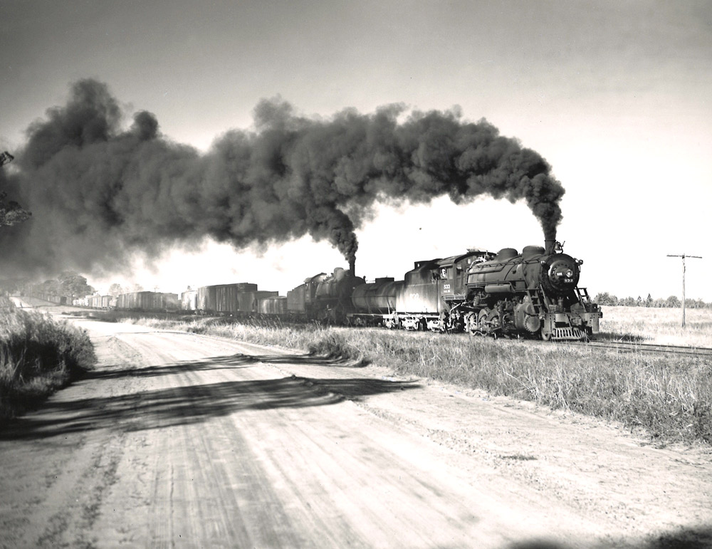 Two steam locomotives on freight train