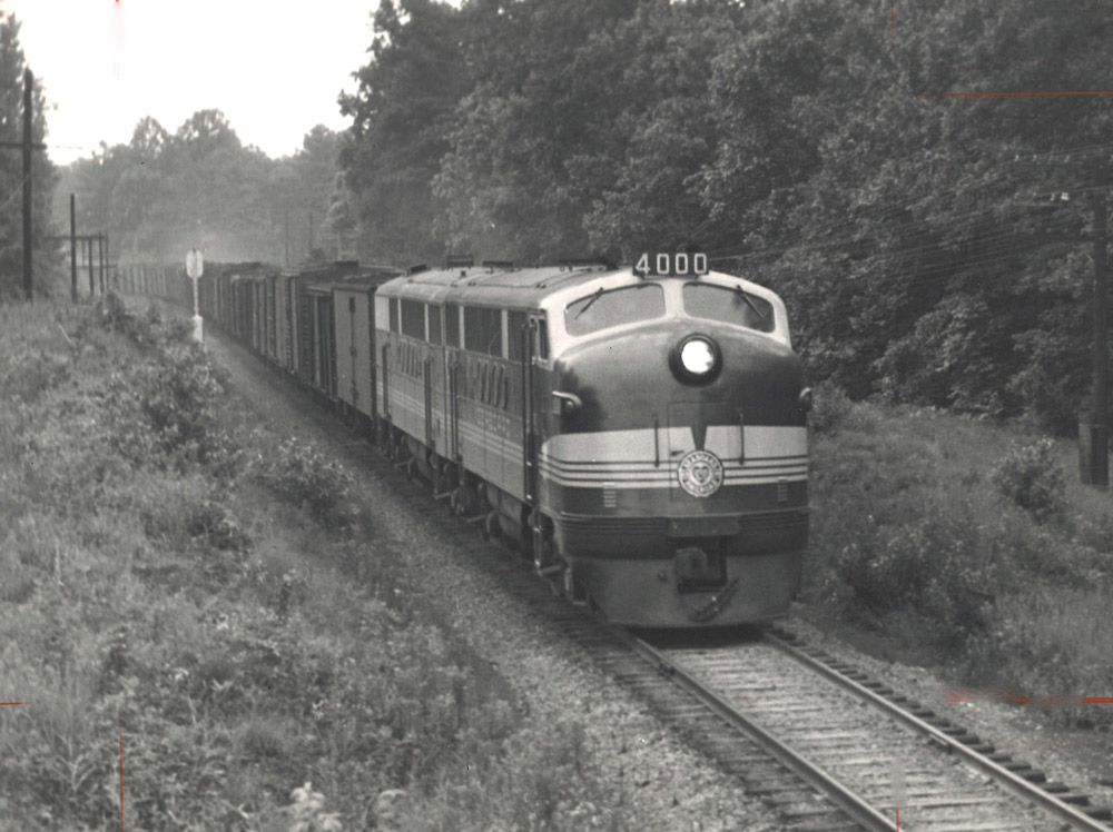 Streamlined diesel locomotives with freight train