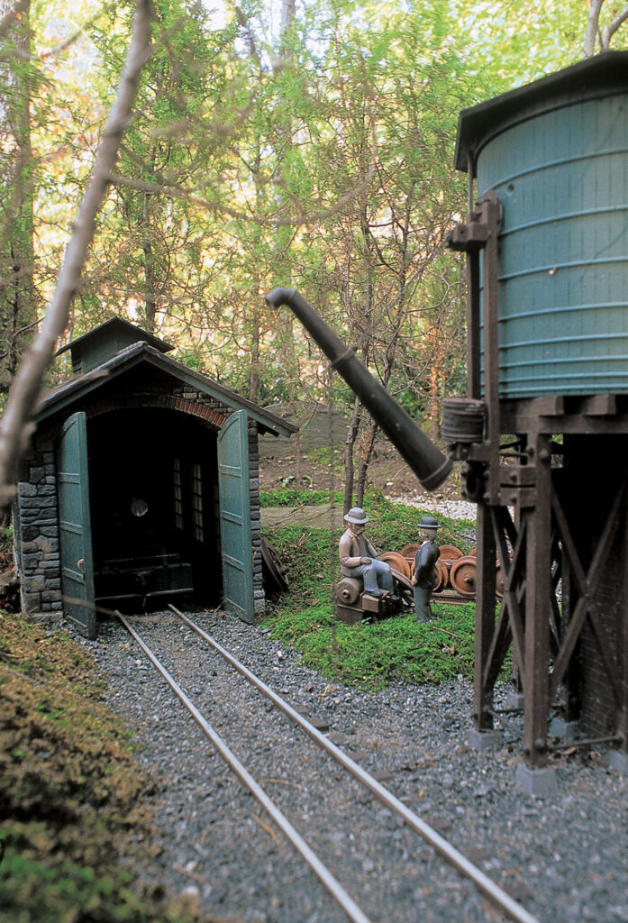 Custom-built storage shed and water tower on Jim Strong’s Woodland Railway