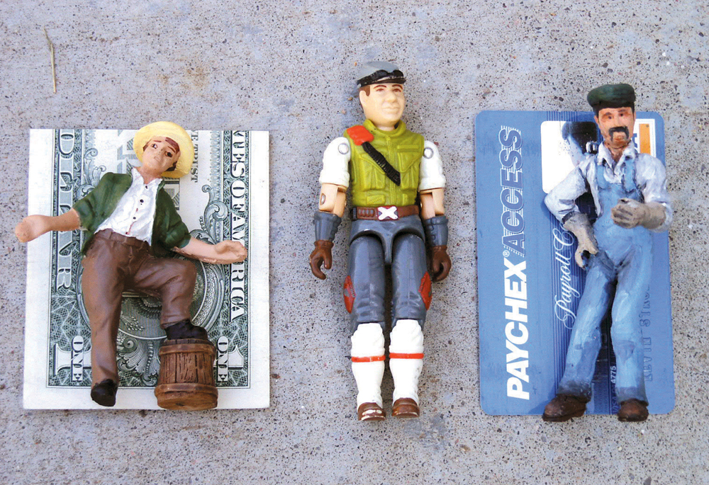 Large-scale figures posed next to dollar bills to determine scale