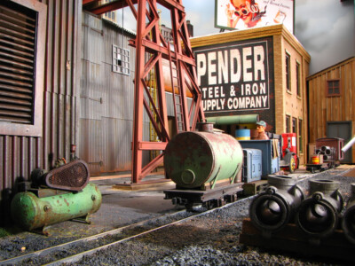 Industrial scenes, a restored steam locomotive, aged diesels, and other model railroad photos