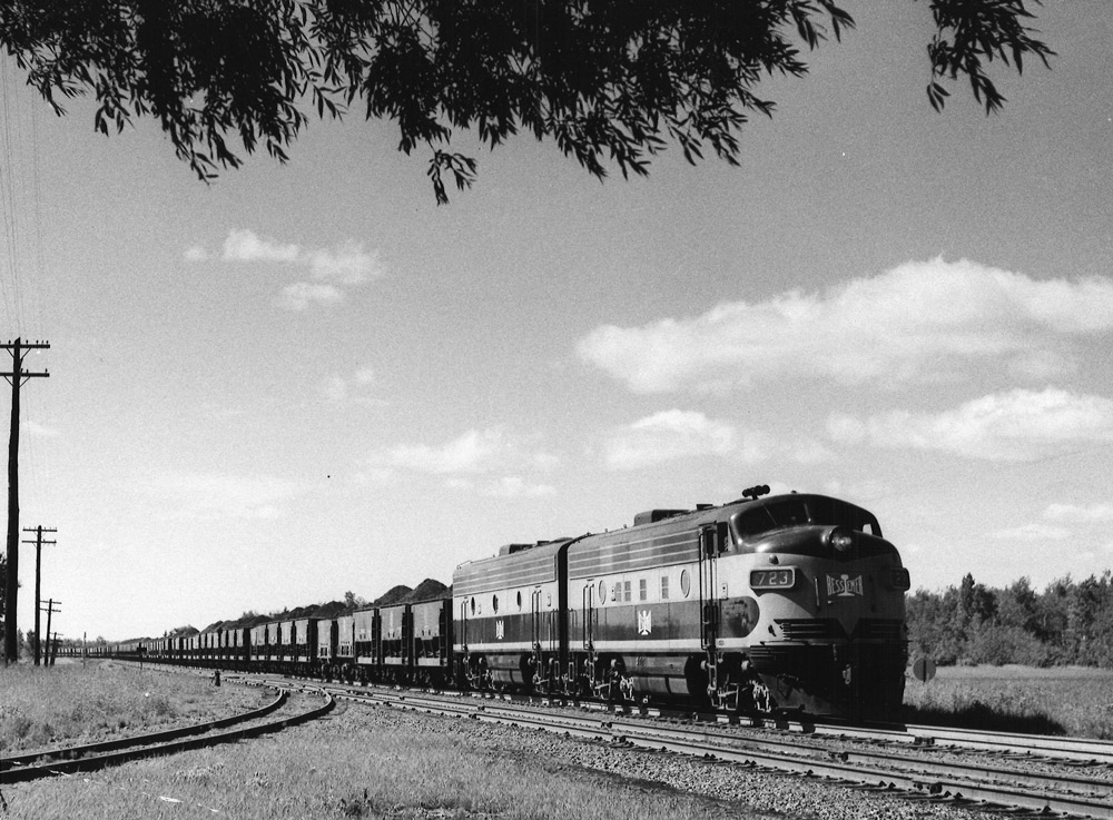 Streamlined diesel locomotives with freight train