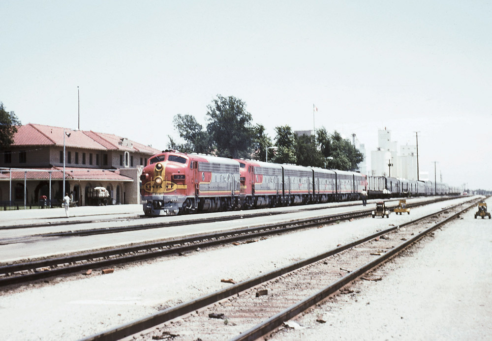 Rear view of motor passenger train at station