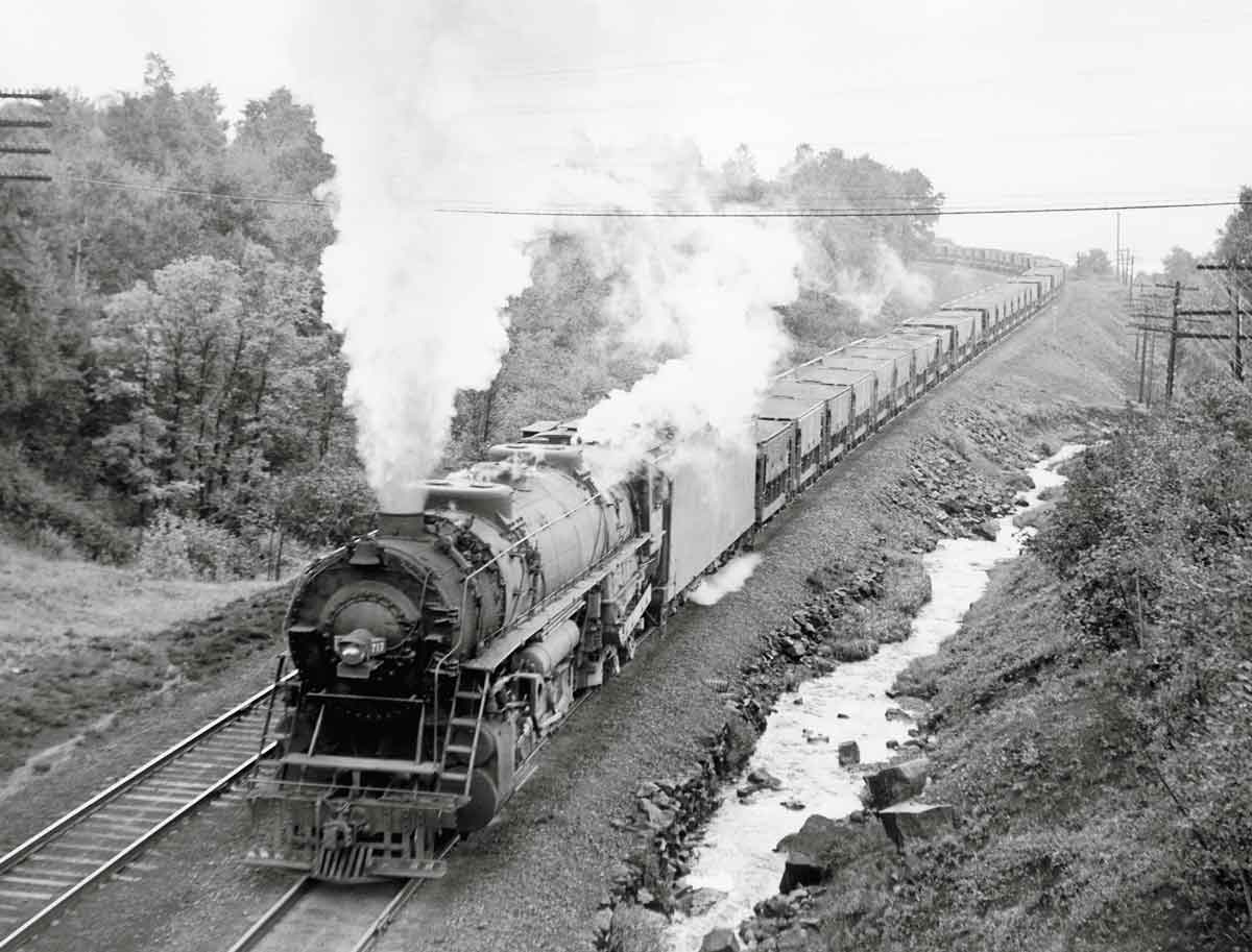 Steam locomotive with freight train