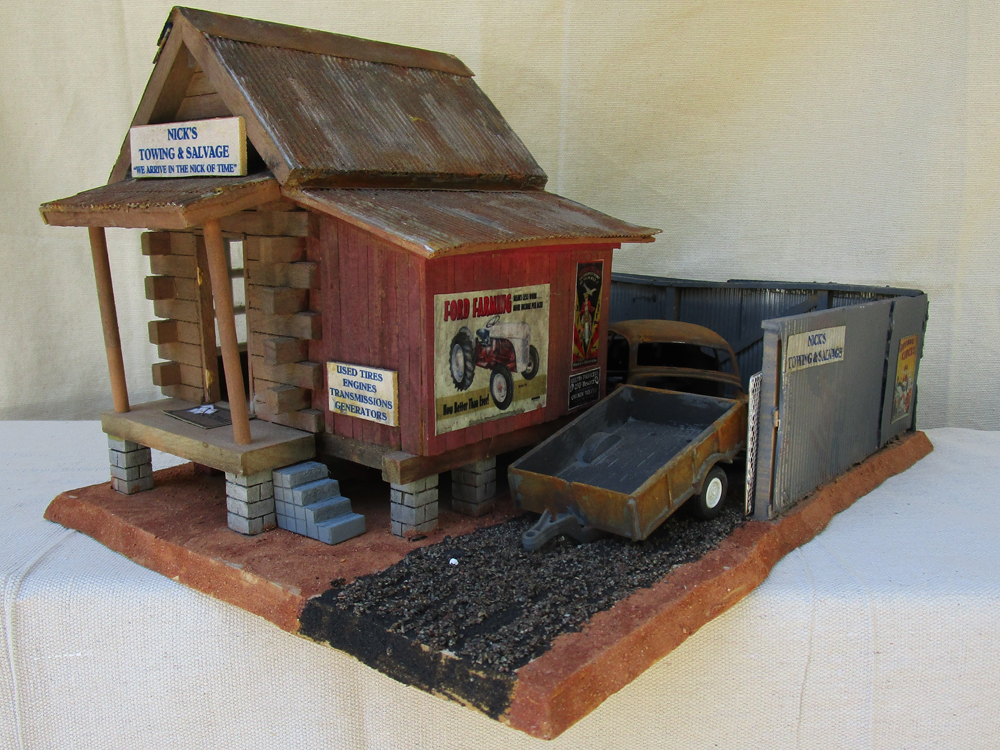 Nick’s Towing & Salvage structure made from a wooden birdhouse