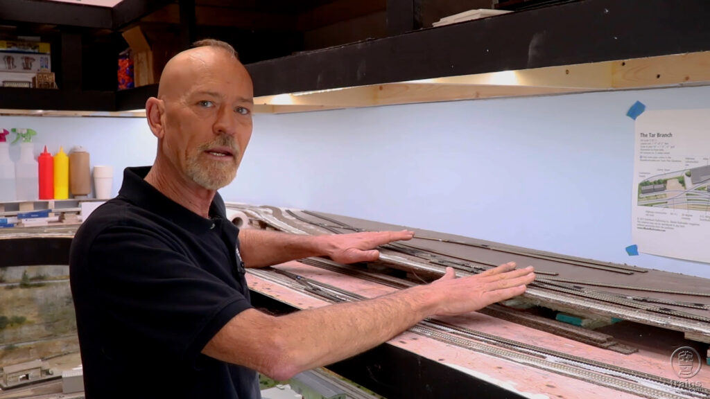 Steve Brown laying track on his N scale model railroad