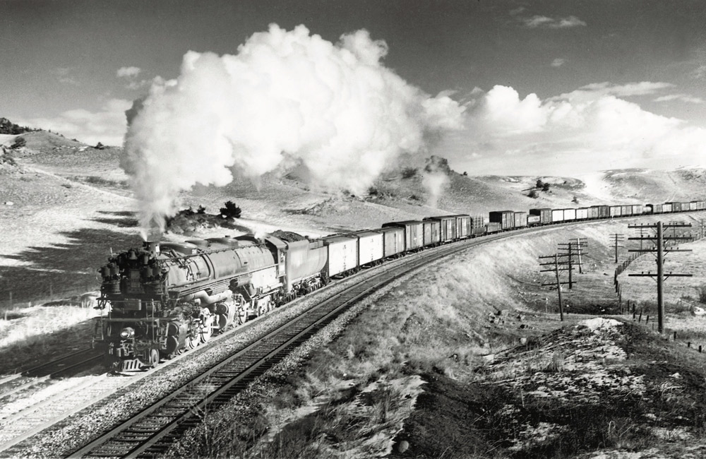 Steam locomotive with freight train.