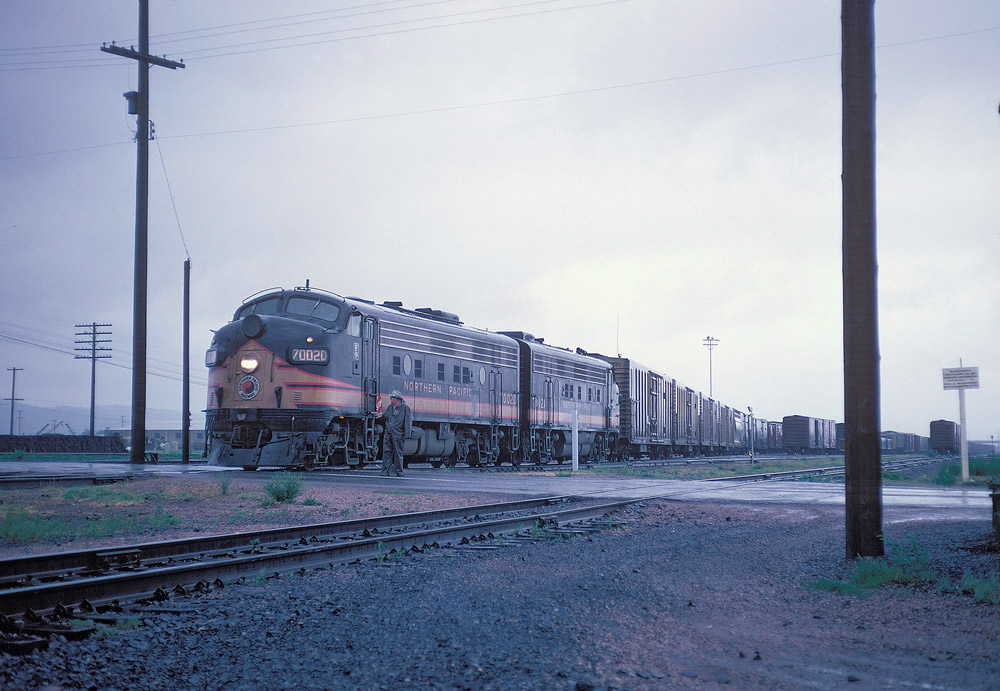 Streamlined diesel locomotives on freight train.