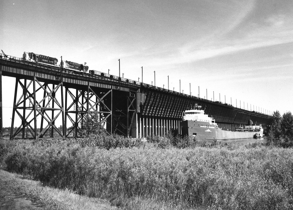 Road-switcher diesel locomotives with hopper cars on ore dock