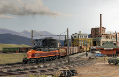 A “Little Joe” electric locomotive, a sleek commuter train, a UP coal drag in the mountains, and other model railroad photos