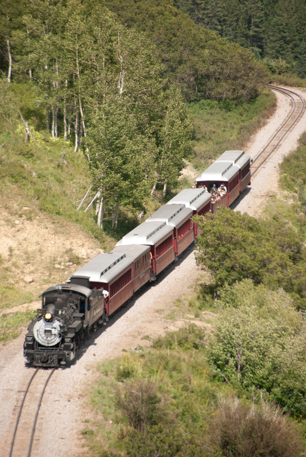Overhead view of train approaching curve