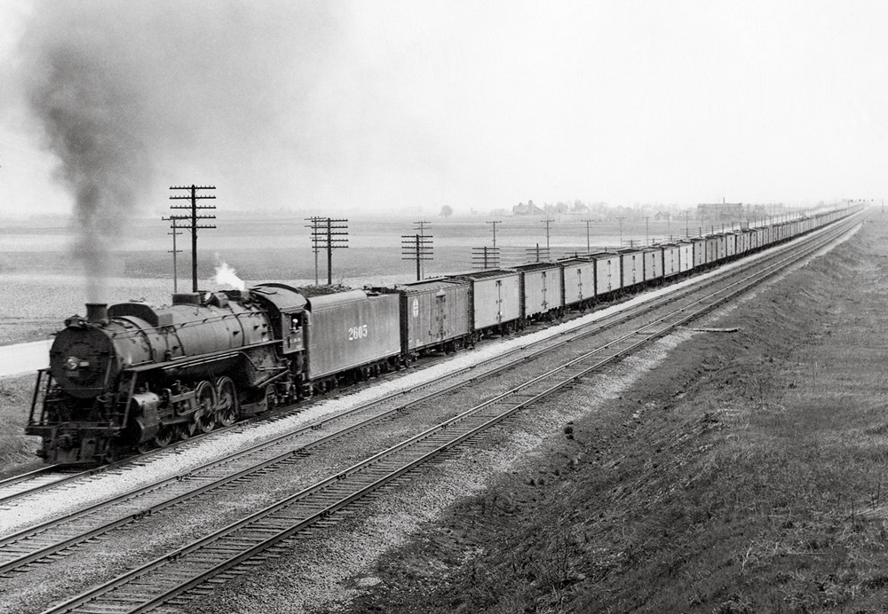 Steam locomotive with freight train
