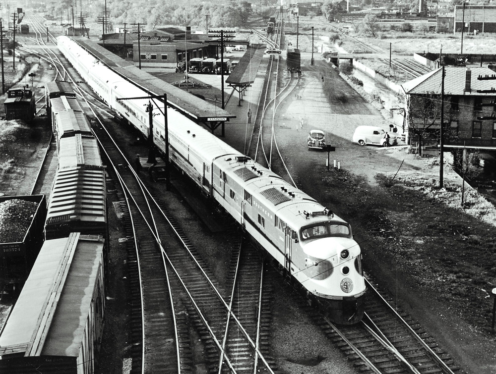 Streamlined diesel locomotive with passenger train