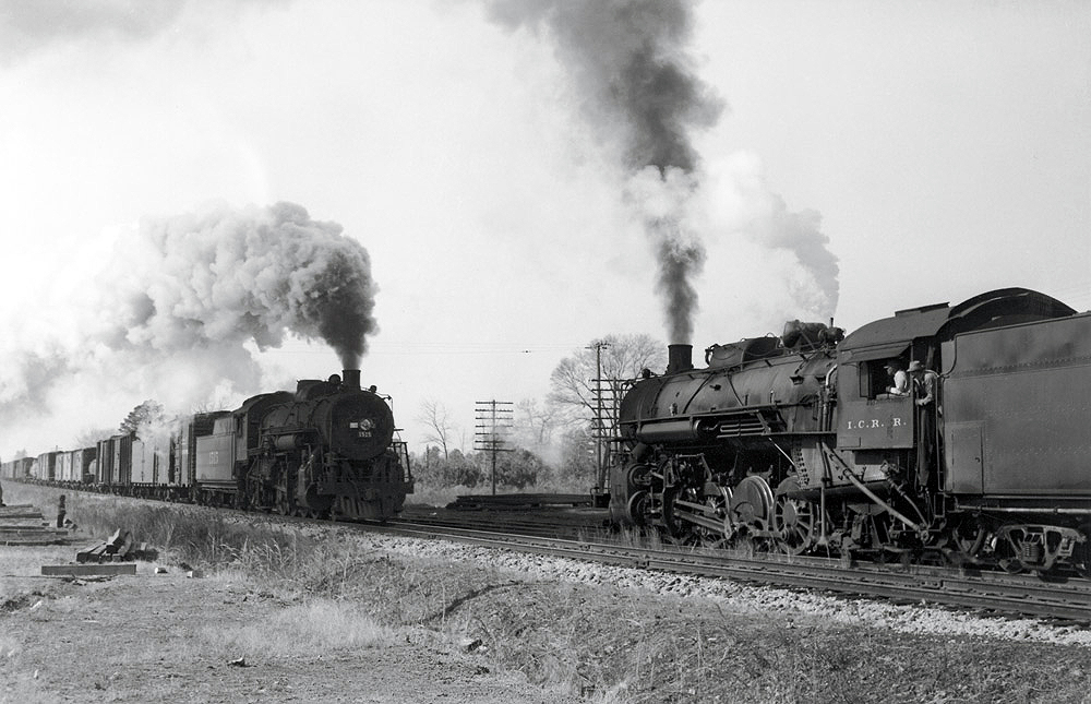 Steam locomotives on two freight trains meeting