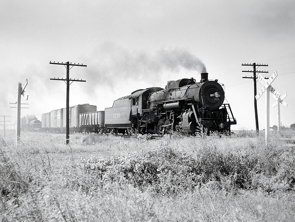 Steam locomotive with freight train