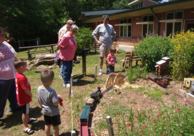 Visit a garden-railway display at a nature center
