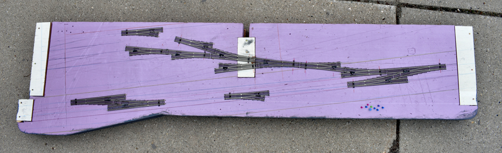 Atlas code 83 turnouts on pink extruded-foam insulation board layout surface