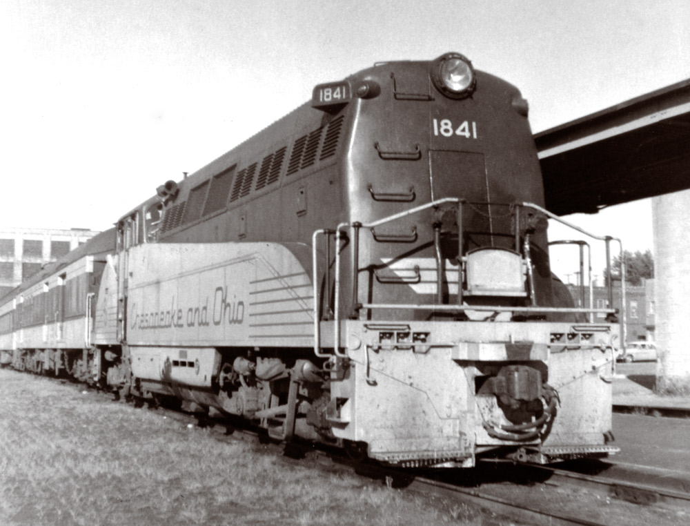Rear of diesel locomotive along station platform canopy