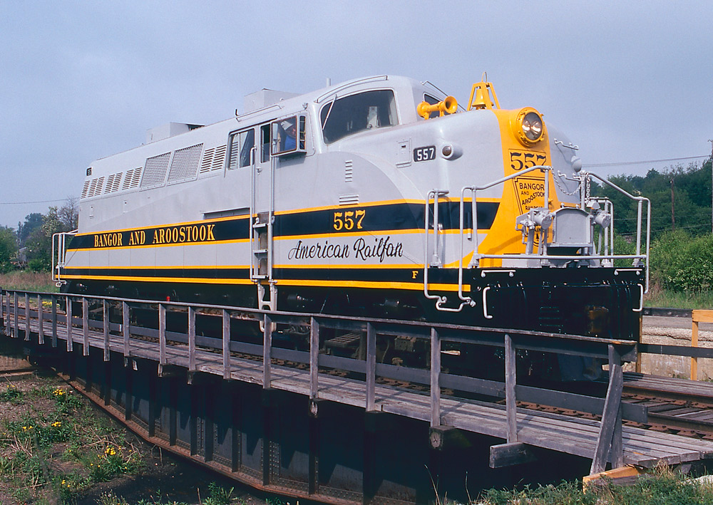 Gray and blue diesel locomotive on turntable