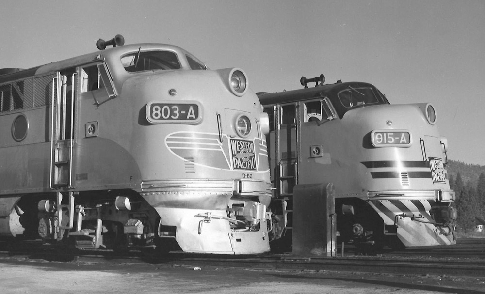 Black-and-white view of the noses of two streamlined diesel locomotives