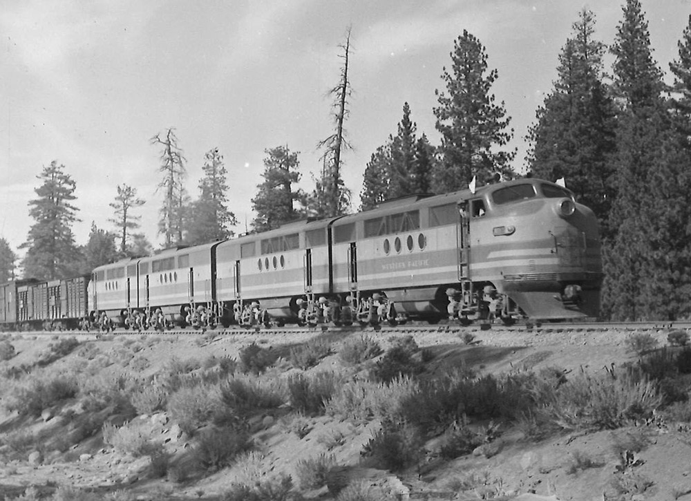 Black-and-white view of four-unit streamlined diesel locomotive